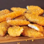 Solomillo de pollo empanado cornflakes (musculo entero) - Délices & Snacks