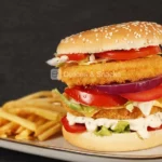 Maxi hamburguesa de pechuga de pollo empanada - Délices & Snacks